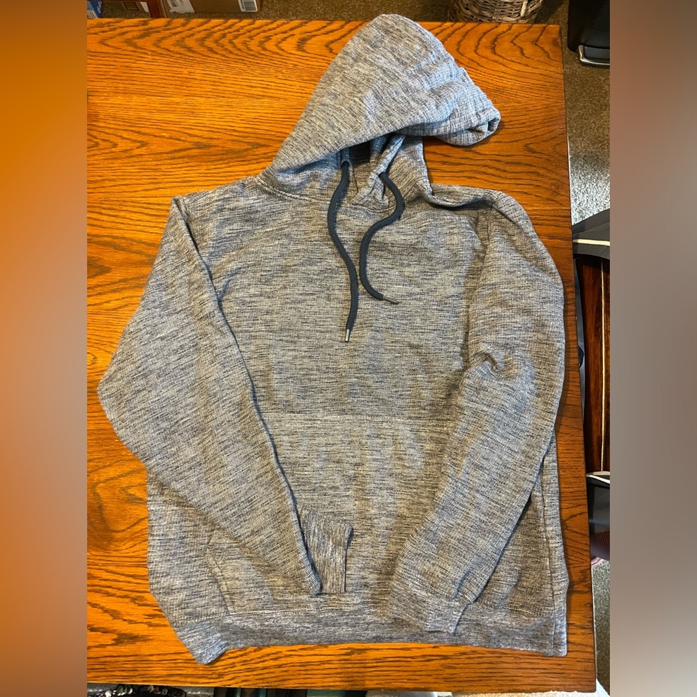 Men’s SUPER MASSIVE brand navy blue hooded sweatshirt with front pocket.